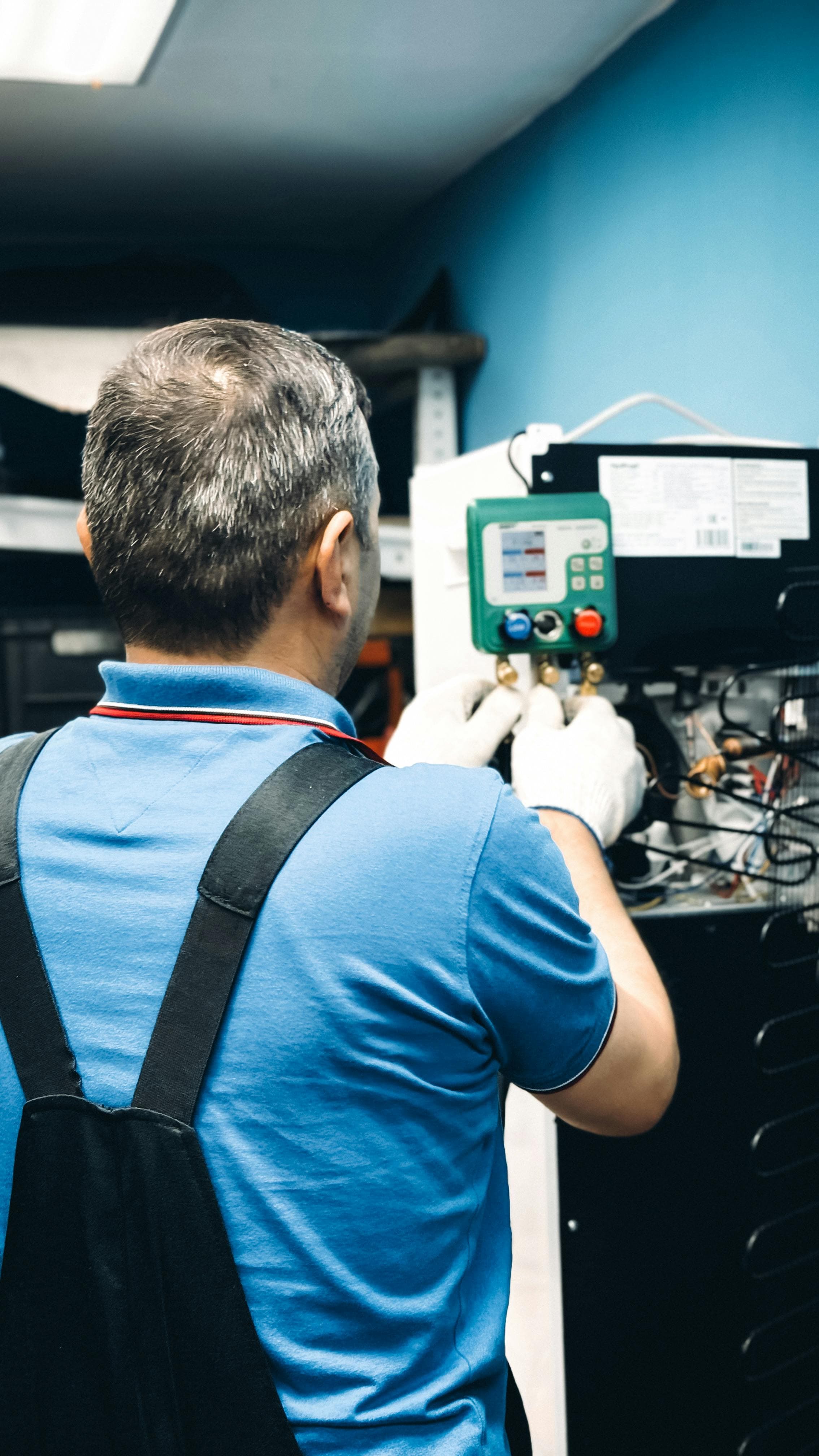 Maintenance technician servicing equipment